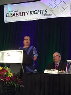 A speaker at the podium during NDRN Annual Conference plenary
