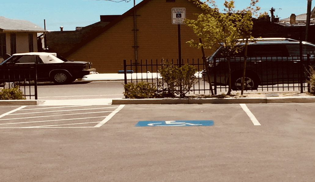 An accessible parking space with an access aisle and appropriate signage