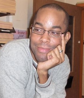 Christopher M. Bell, an African American man in his late 20s-early 30s in a gray sweatshirt.