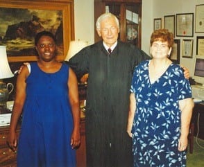 Lois Curtis and Elaine Wilson smile for the camera with Judge Shoob, the judge in the Olmstead case. 