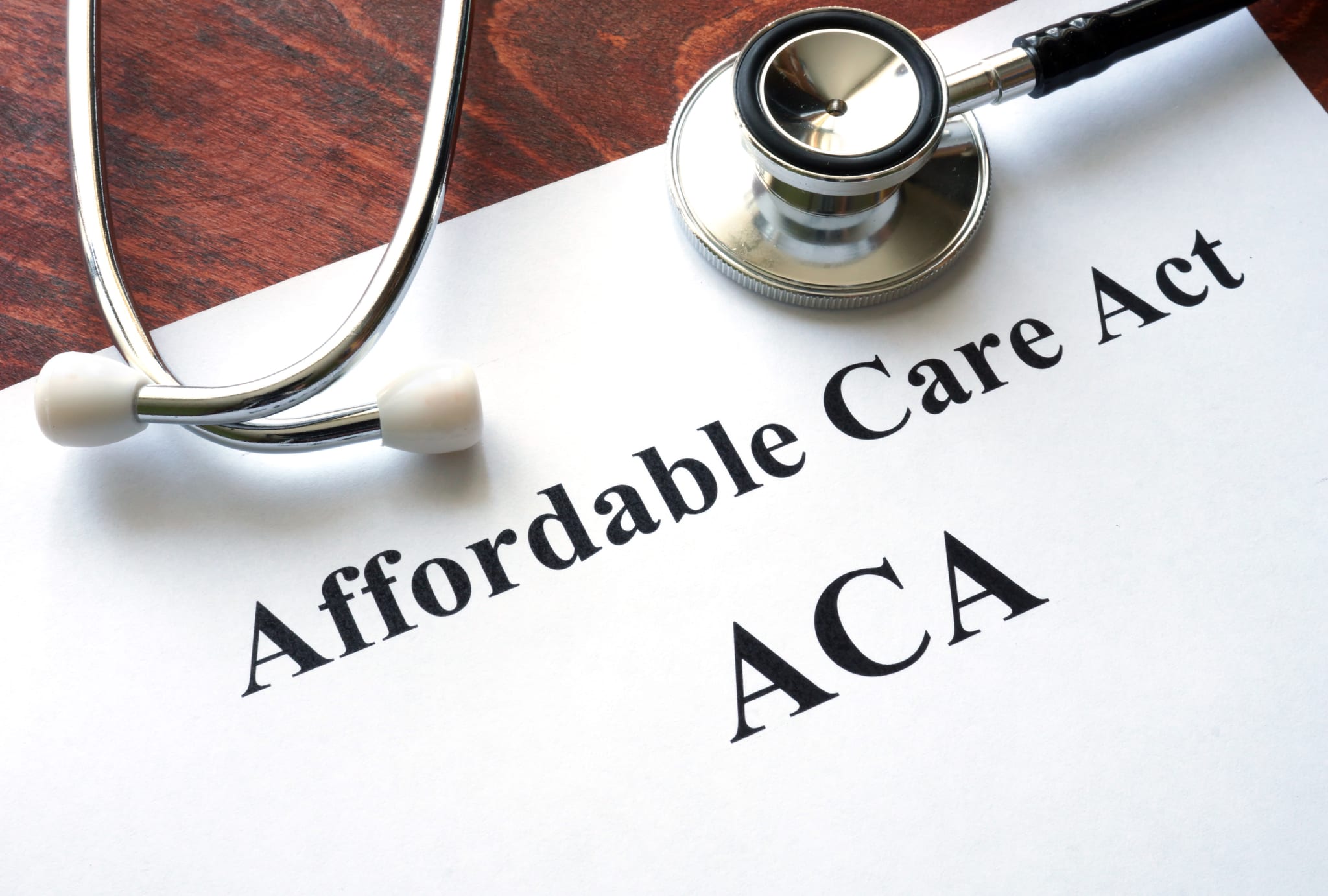 Words Affordable Care Act ACA written on a paper with a stethoscope