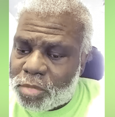 Bernard, a black man with a white beard, fills the frame and wears a green shirt
