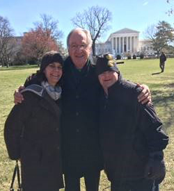 Image of Evan Nodvin and an unidentified woman with Senator Harkin near the Capitol Building